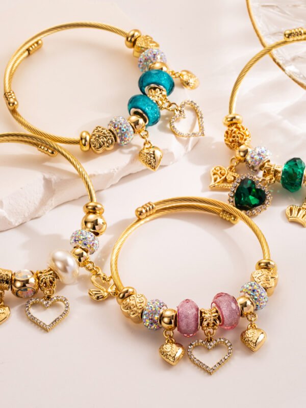 New stainless steel bracelet with diamond and crystal setting, love pendant, adjustable opening.